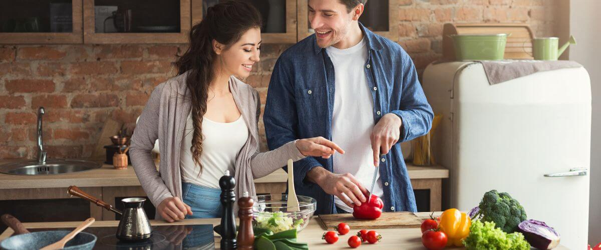 Newlywed couple cook together, creating their own way of doing things.